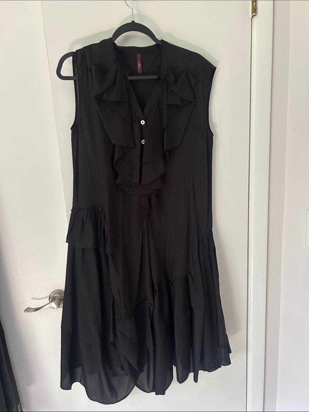 Sleeveless Black Ruffle-Front Tunic Top